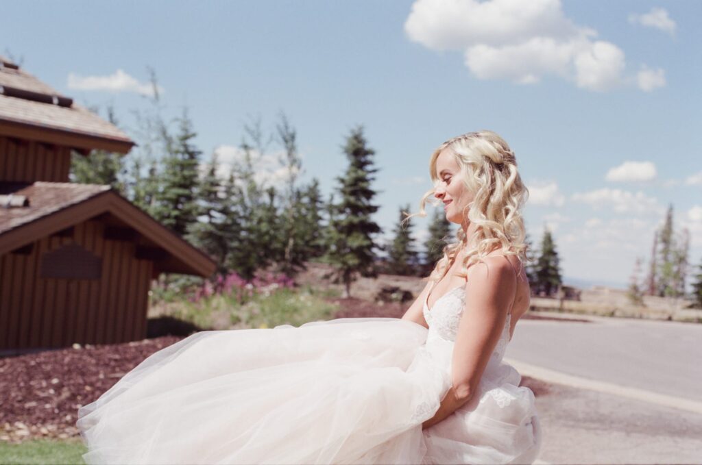 Bride in bridal dress photographed outdoors by Robin Jolin.