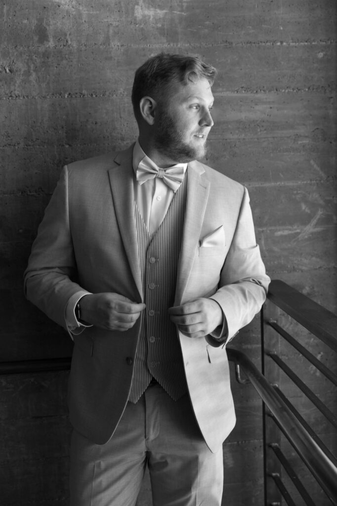 Editorial style photography of the bridegroom in wedding suit.