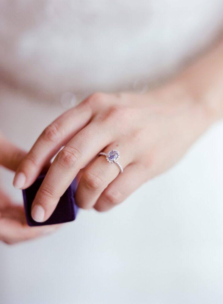 Bride shows her engagement ring.