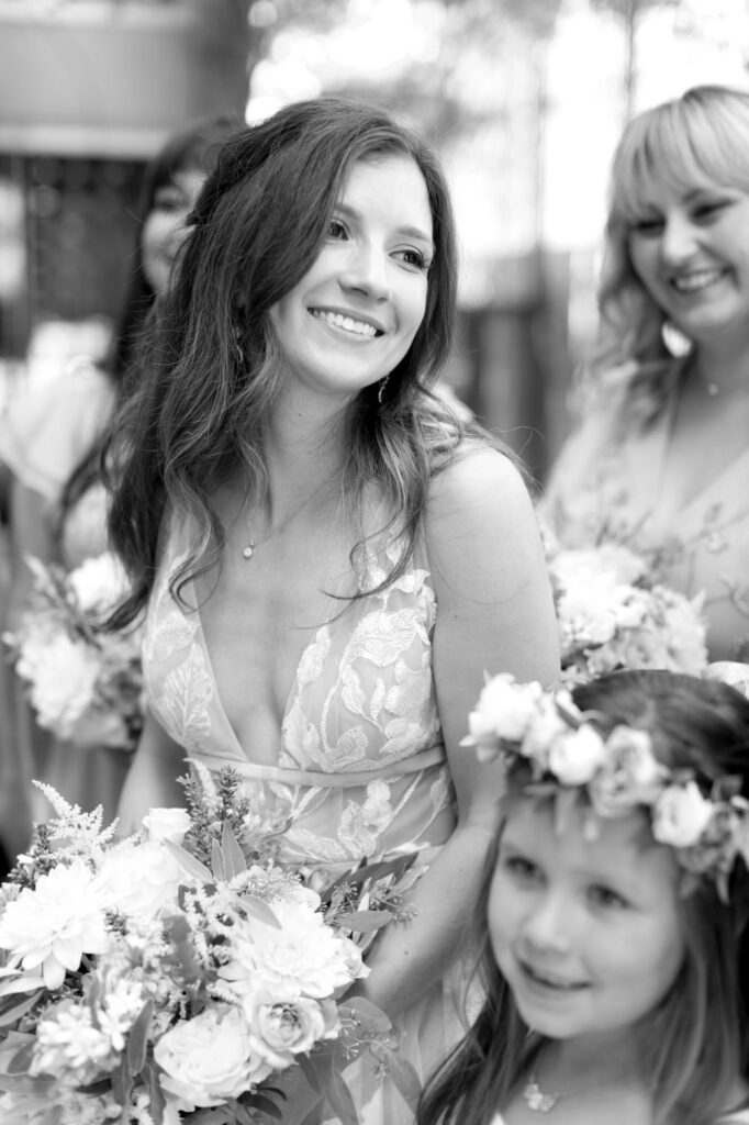 Bride Jillian smiles at her wedding ceremony.