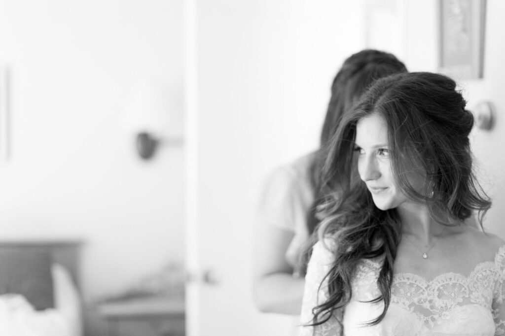 Bride with disheveled hair in her wedding gown.