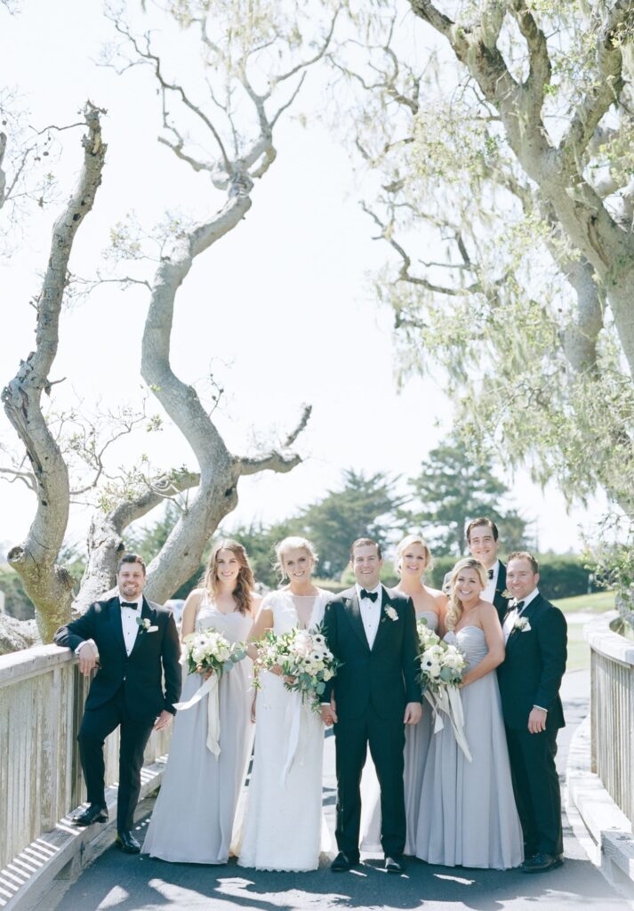 The core members of a luxury destination wedding at Pebble Beach.