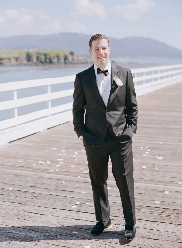 Handsome groom in his wedding outfit at Pebble Beach.