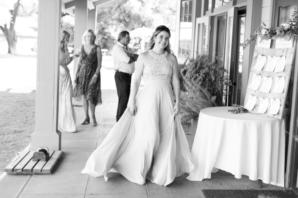 Bridesmaid walks into the wedding venue.