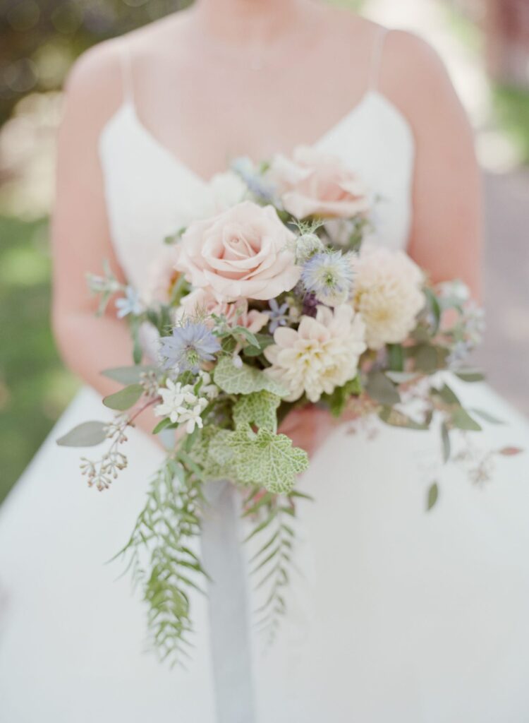 Piedmont Wedding bride holds a flower bouquet.