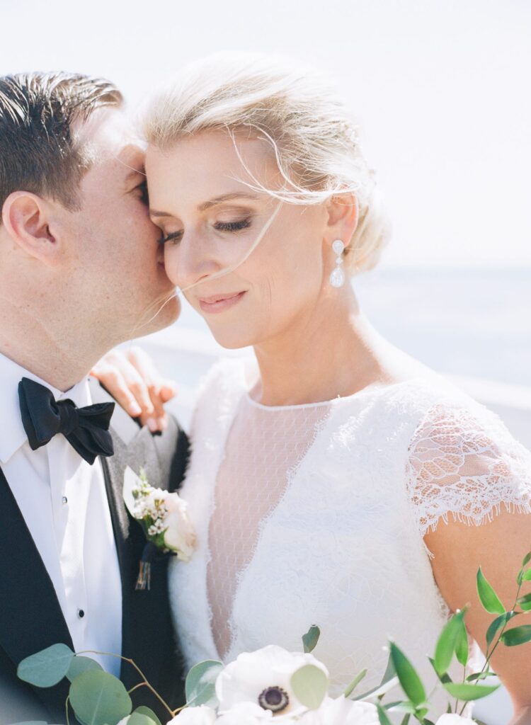 Groom whispers to his bride.