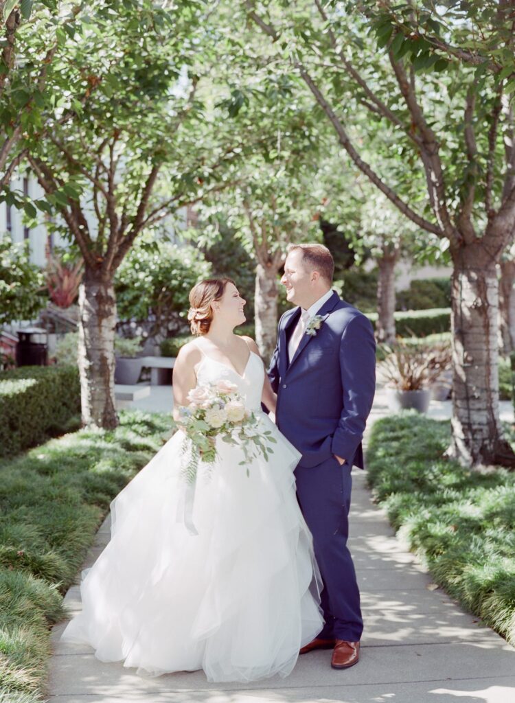 Robin Jolin captures bride and groom at a garden alley.