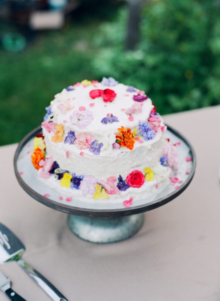 San Juan Island Wedding reception cake with colorful flower designs.