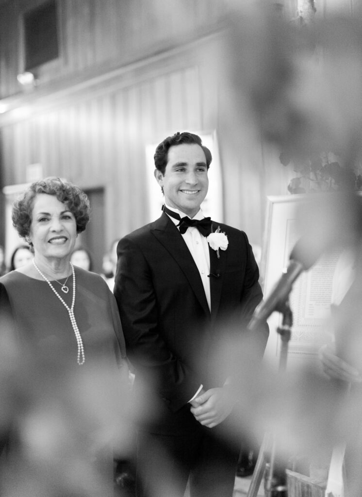 Elegantly dressed bridegroom with his mother.