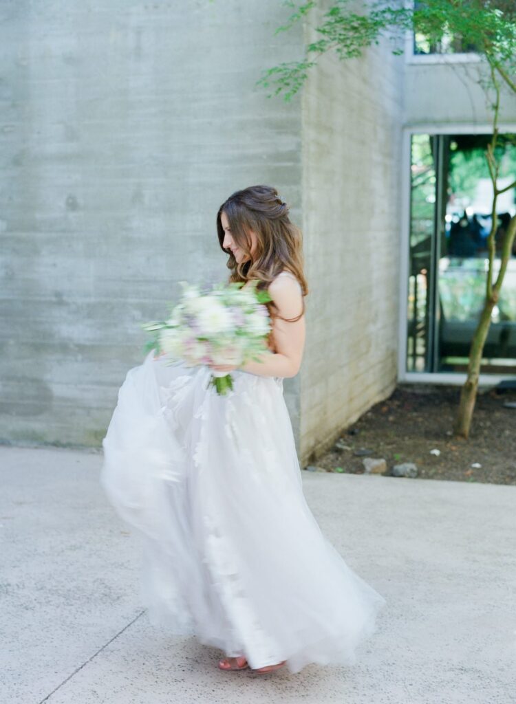 Aesthetic bride in wedding dress and a flower bouquet.