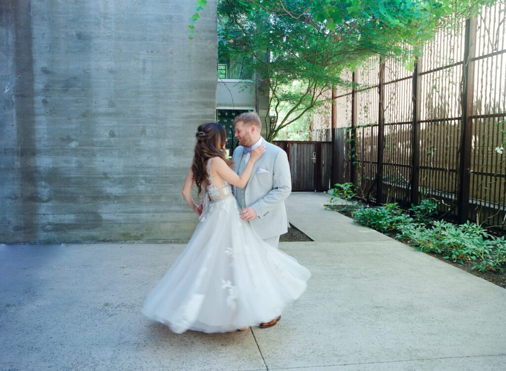 Bride and groom dance together before their wedding ceremony.