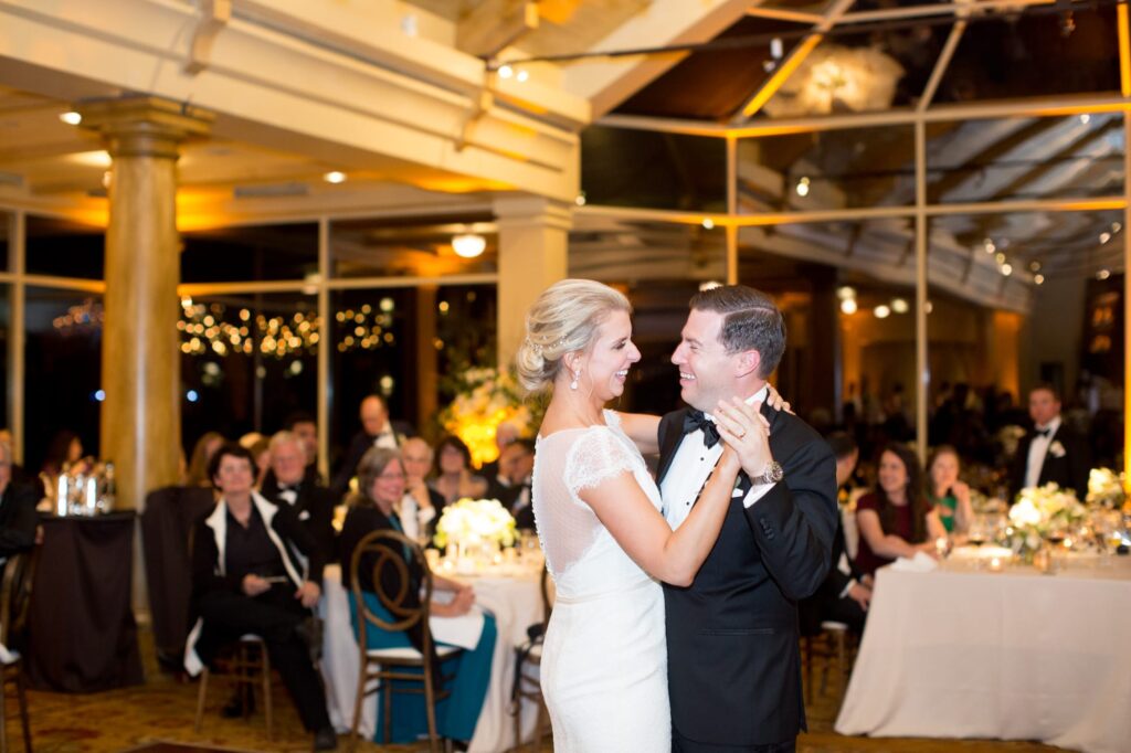 Inseparably couple dances in front of their wedding guests.