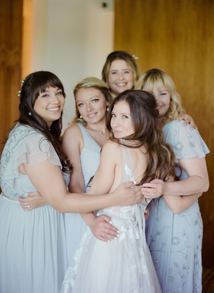 Bride embraces her bridesmaids at a Healdsburg Wedding.