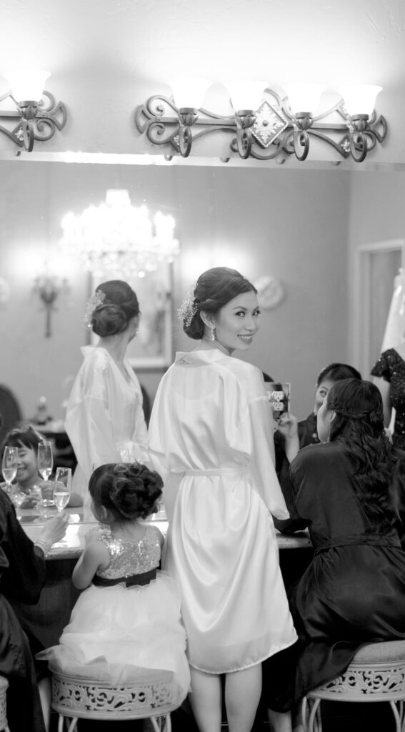 Bride-to-be infront of a large mirror.