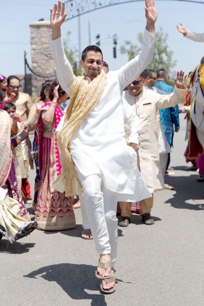 Wedding guests dance at an Indian Wedding.