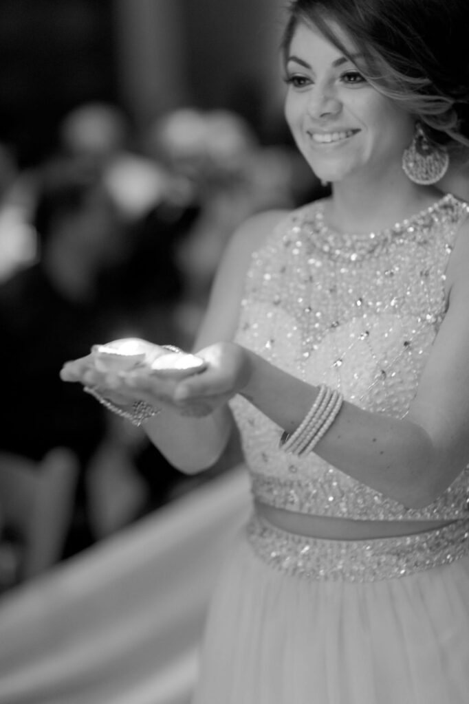 Beautiful girl holds diya lamps.