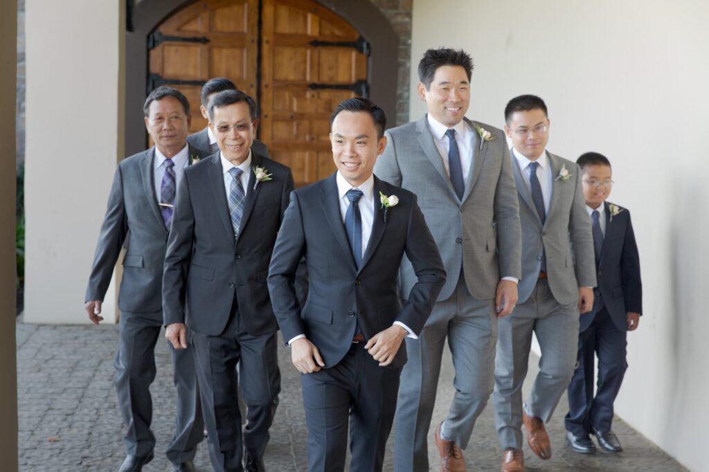 Bridegroom approaches with his groomsmen.