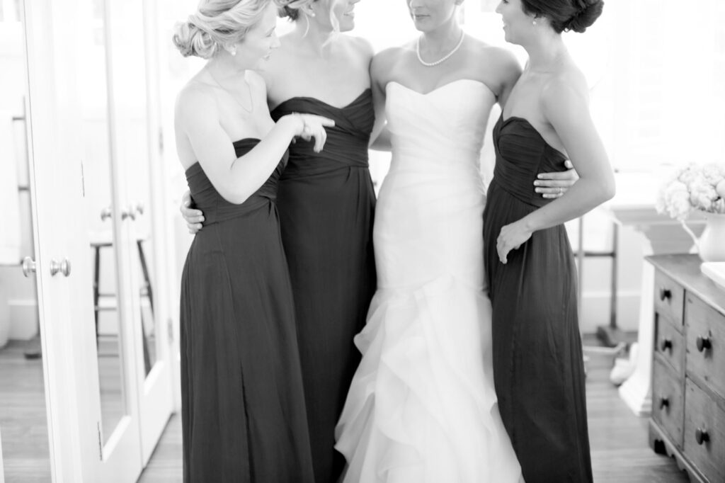 Bride gossips with her three bridesmaids.