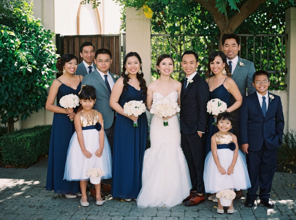 Bride, groom, bridesmaids, and groomsmen pose at Casa Real Ruby Hill Winery 