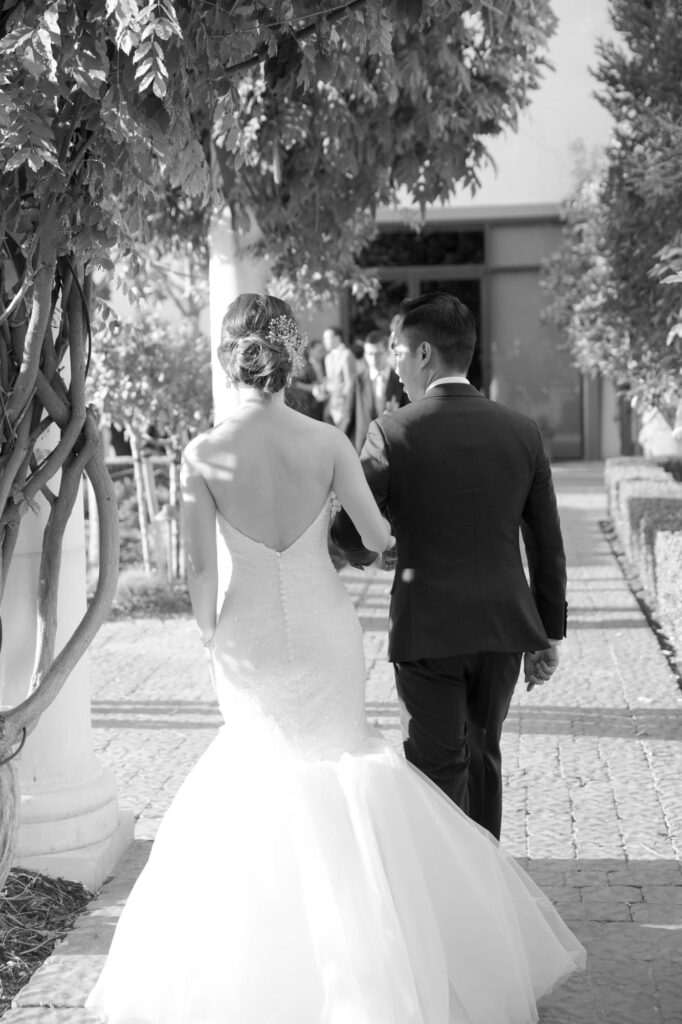 Aesthetic picture of a bride and groom holding hands