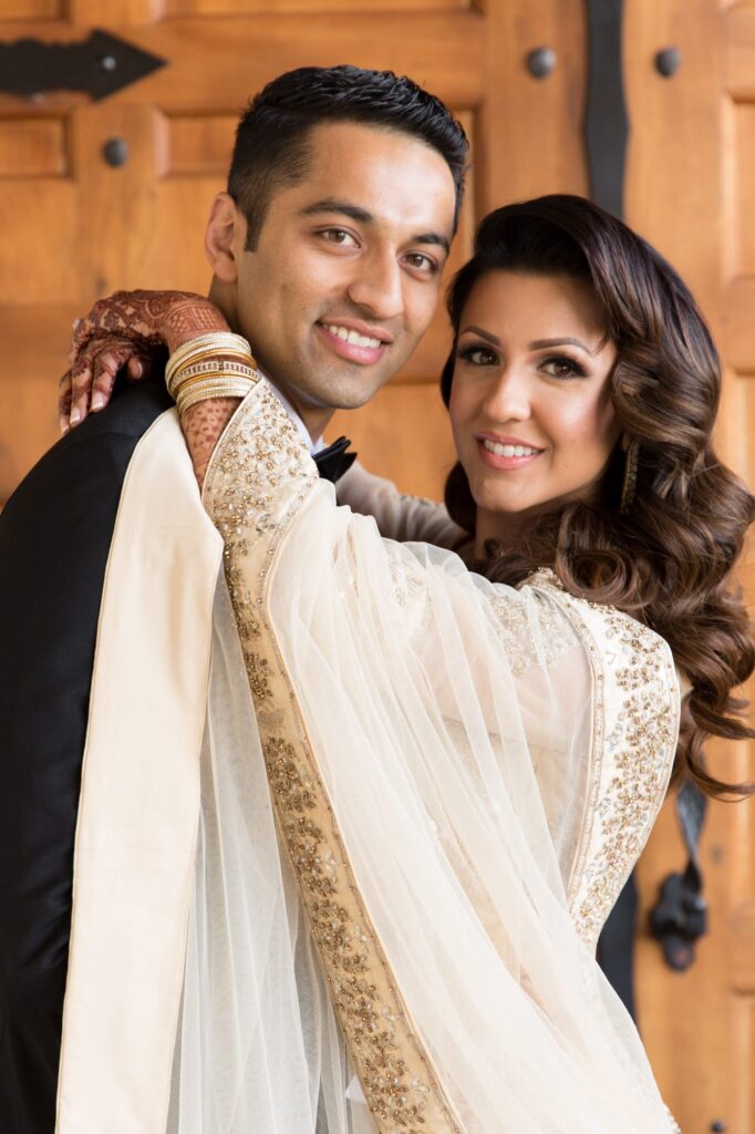 Newly married couple embrace tenderly and pose for Robin Jolin's camera.