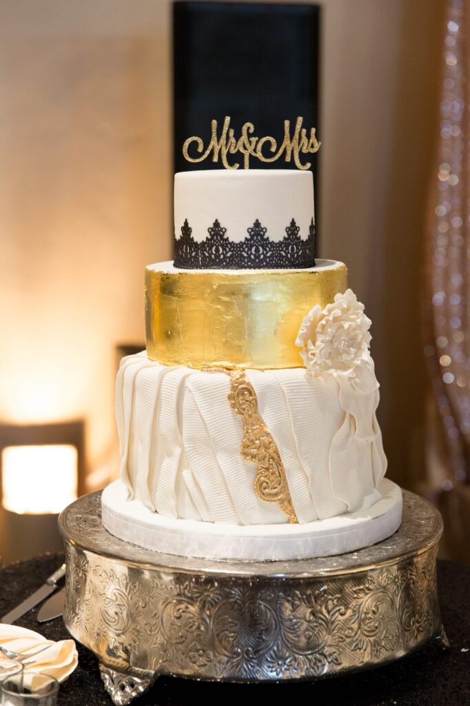 Gold-colored wedding cake.