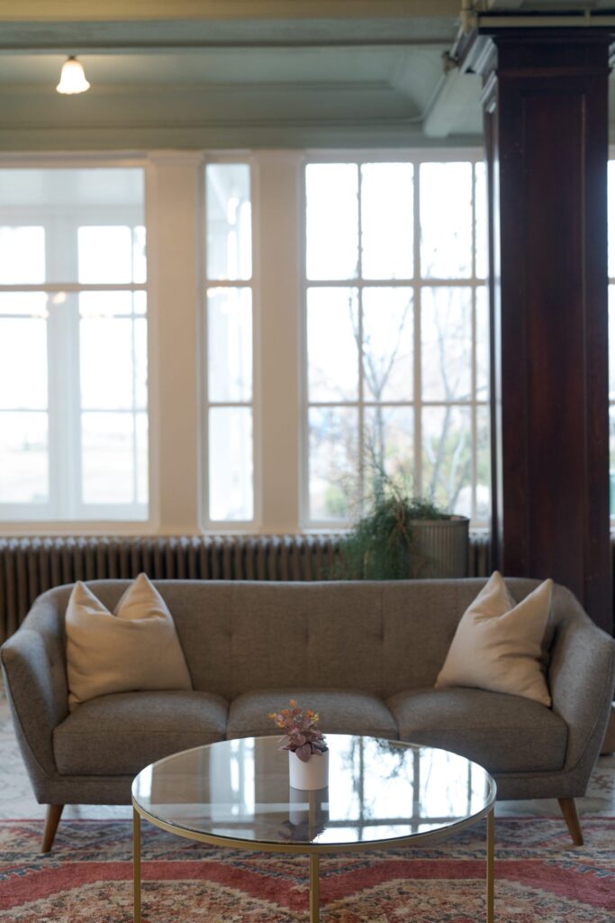 An interior view featuring a gray sofa with two beige throw pillows