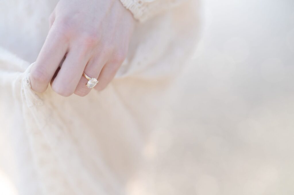 Engagement ring on the hand of a newly engaged fiancee.