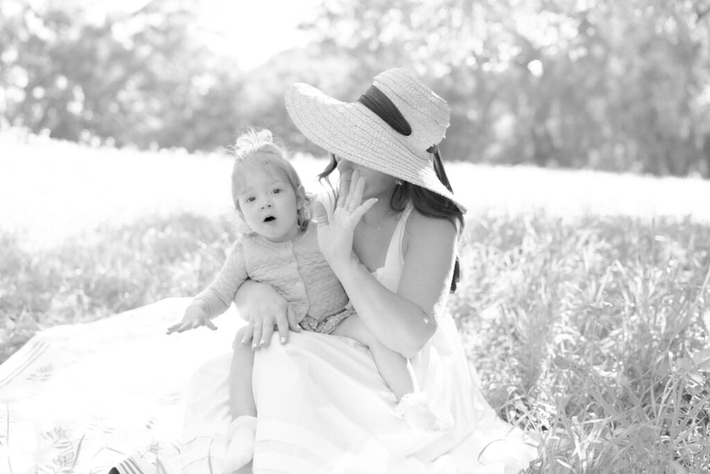 Jilian encourages her daughter to wave at the camera.