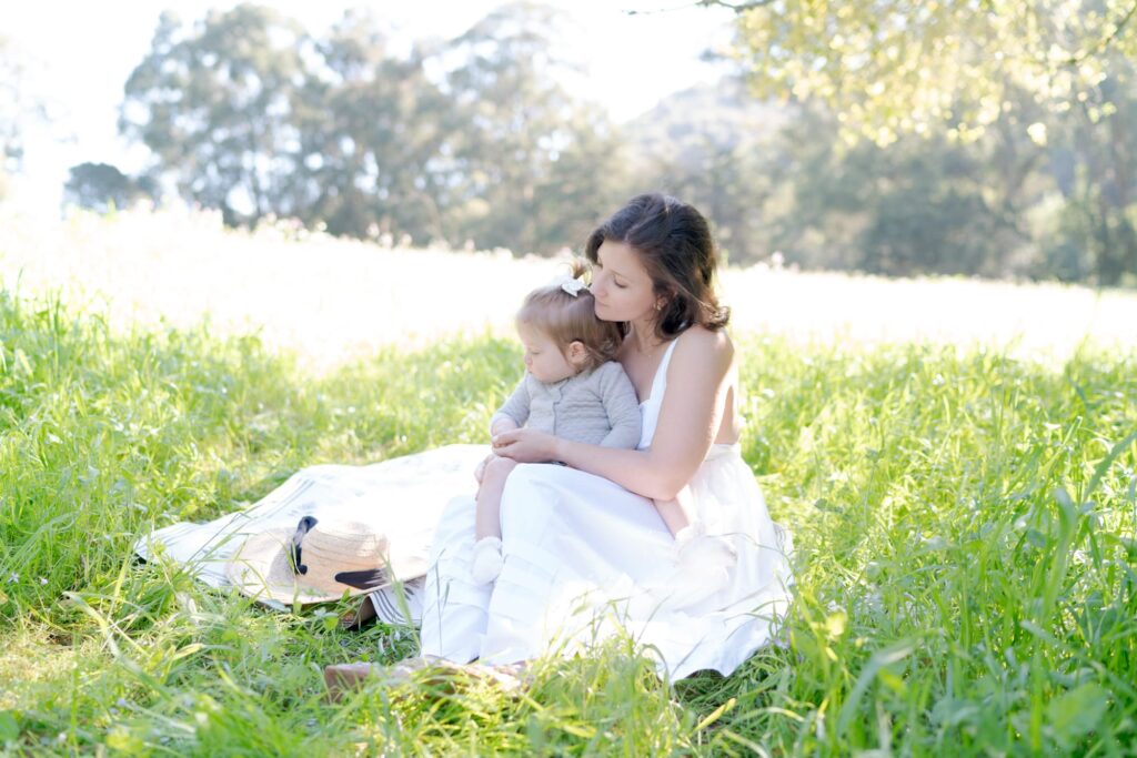 Jilian with her daughter at a nature picnic.