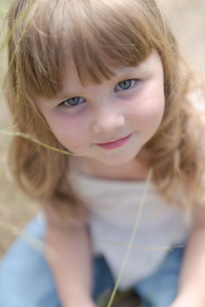 Aesthetic image of a cute baby girl with precious green eyes.