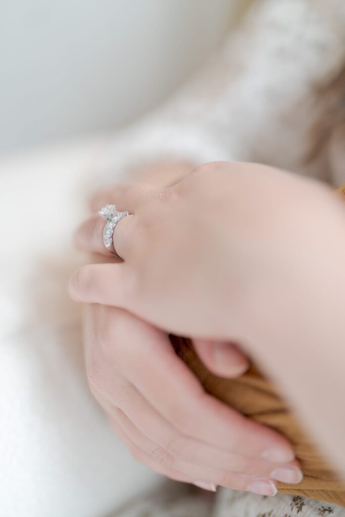 Lady's hands with a diamond marriage ring