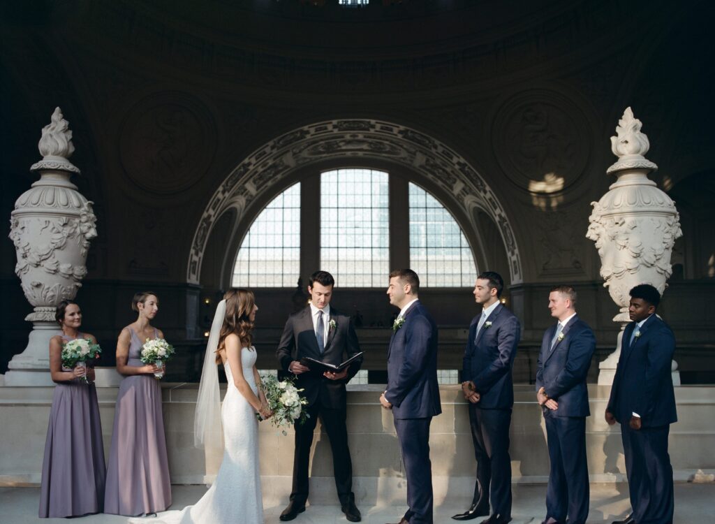 Wedding officiator pronounces the wedding inside the San Francisco City Hall.