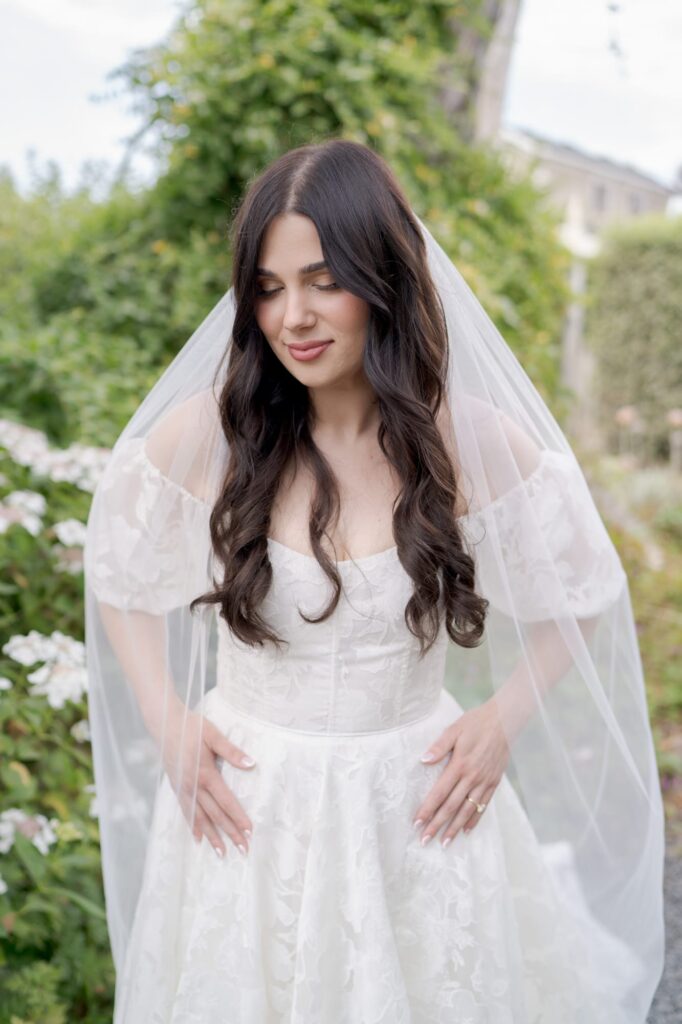 Elegant bridal outfit on a beautiful brunette bride-to-be.