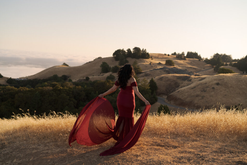 Lady in an elegant maroon dress captured on Mt. Tam.