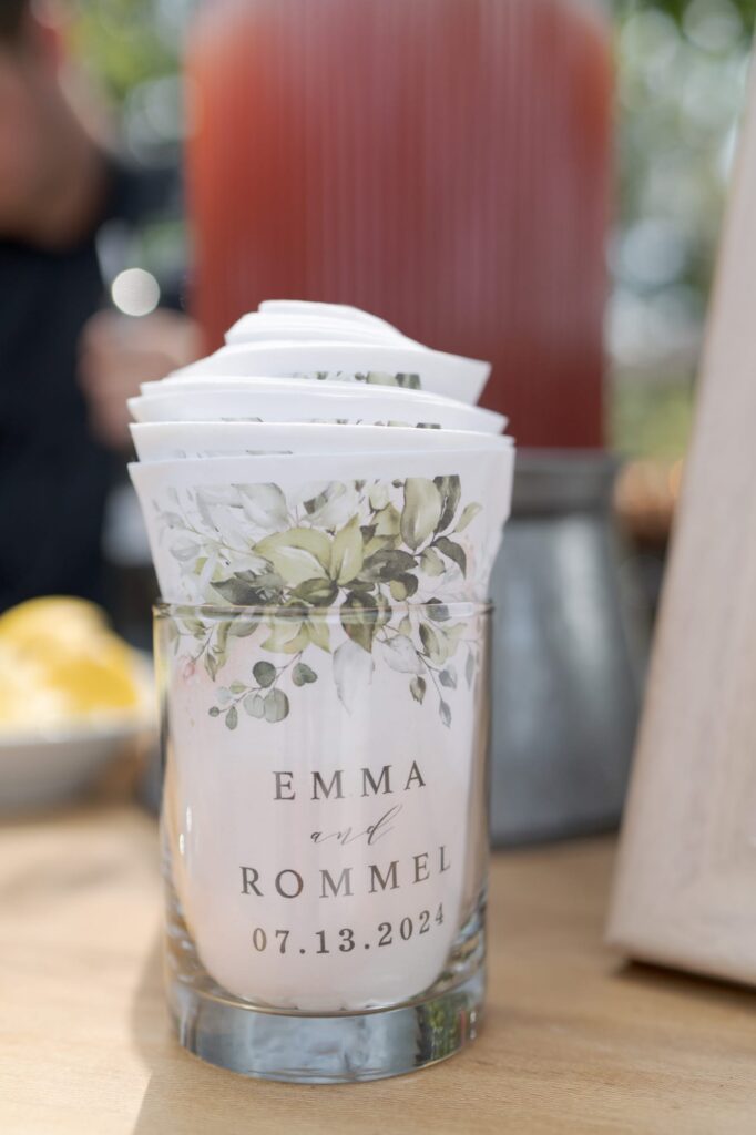 Napkins on a glass vase.