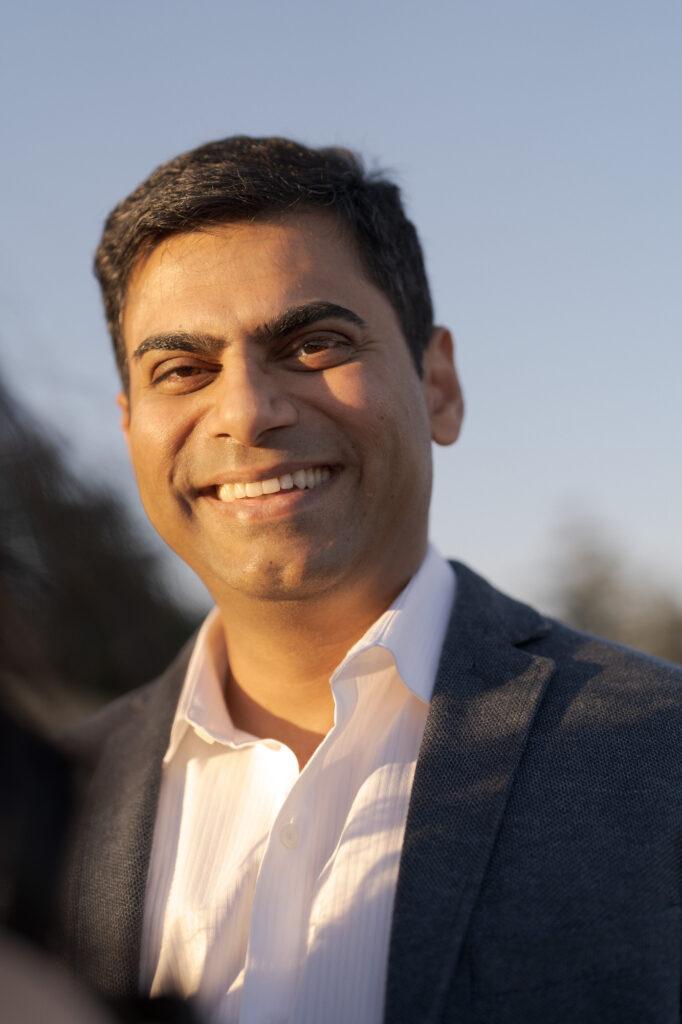 Close-up of a middle-aged man in a white shirt and jacket.