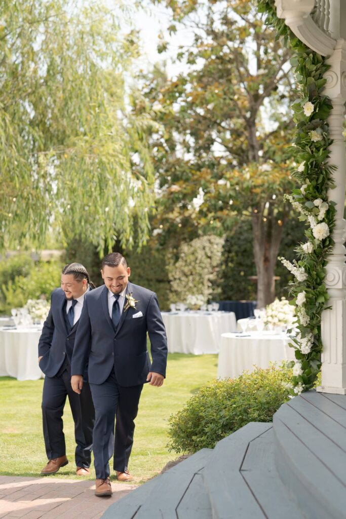 Elegantly dressed groom to the wedding officiation venue with his best man.