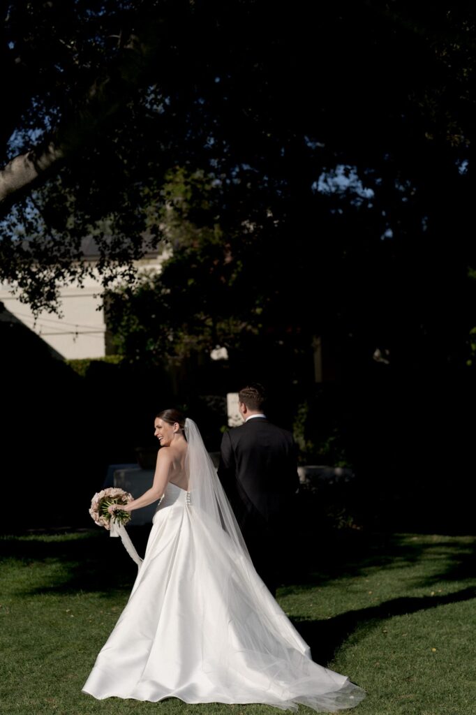 Bride and groom hold hands and walk back up the aisle.