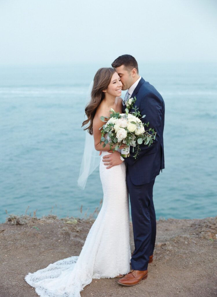 Newly married couple whisper and get close to each other.