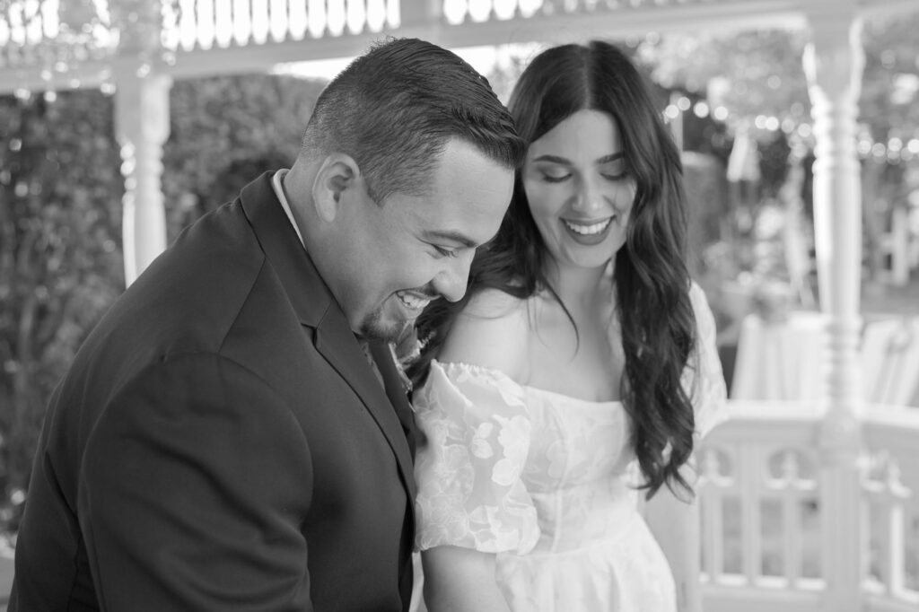 Happy bride and groom at their cake cutting ceremony.