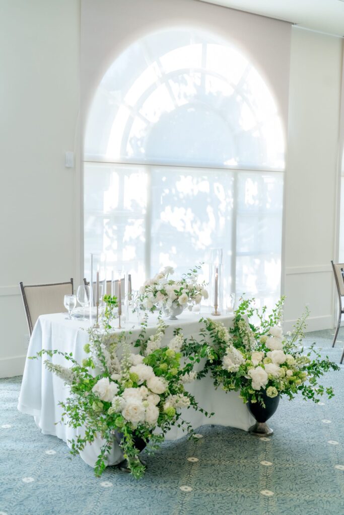 Beautiful flower decoration at a table prepared for the reception party.