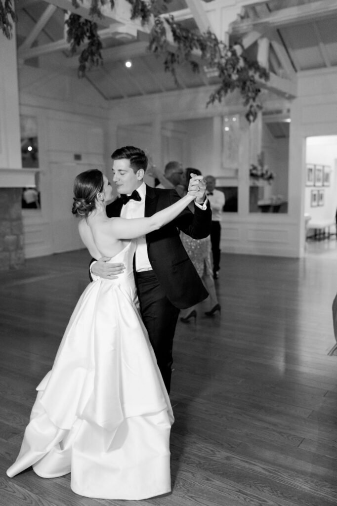 Bride and groom show their ballroom dance moves at their reception party.