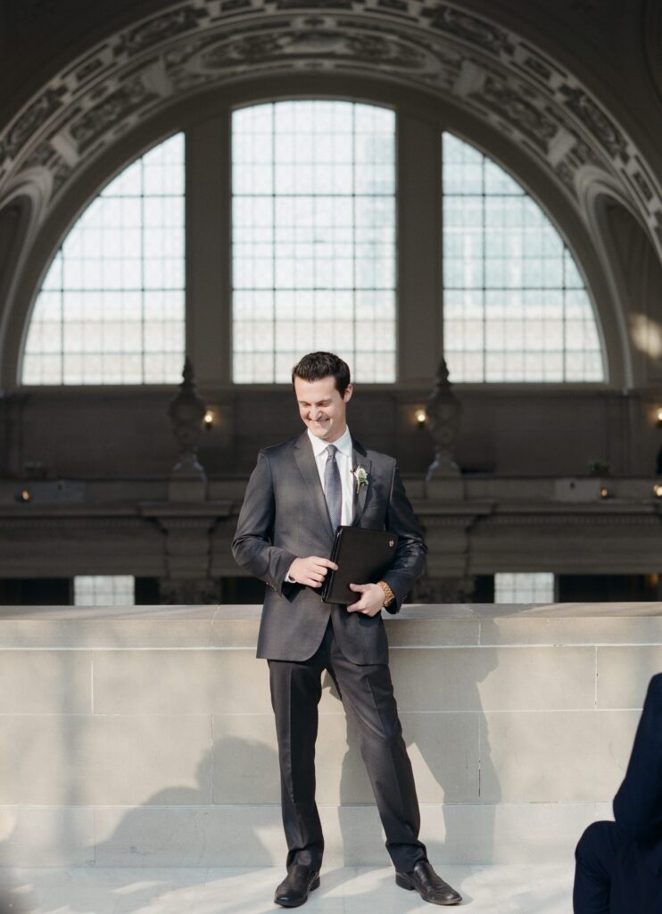 The wedding officiator arrives for a San Francisco City Hall wedding.