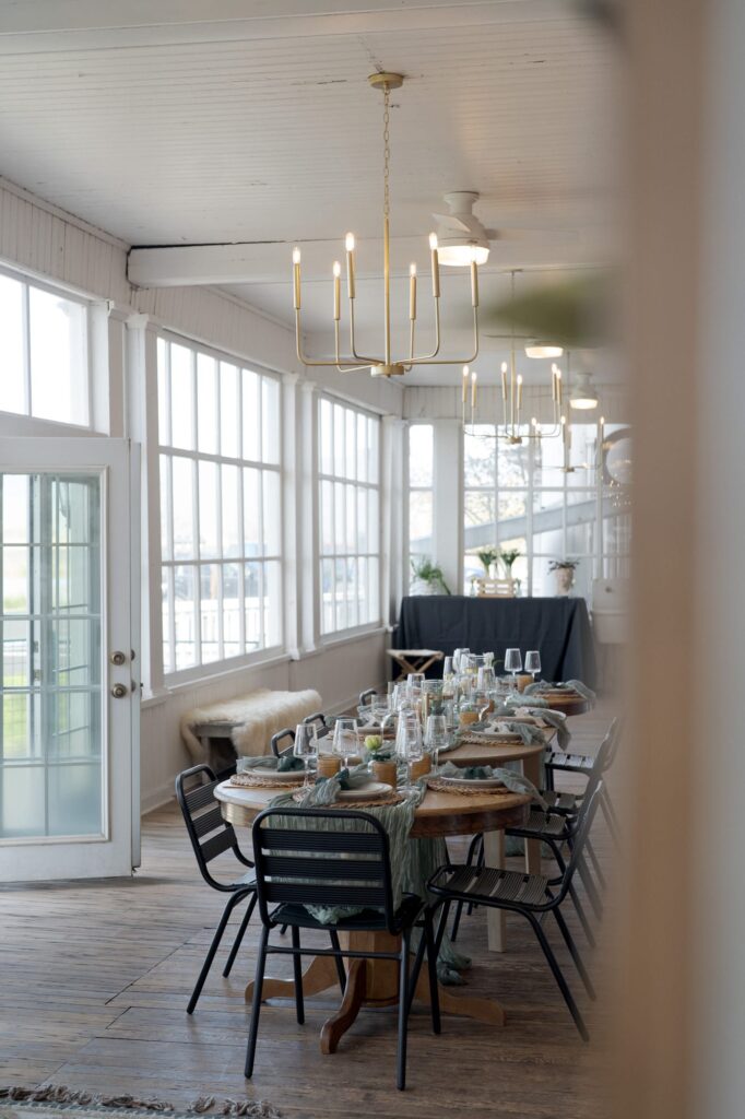 Aesthetically decorated dining hall with big windows and glass doors at Hot Lake Resort.